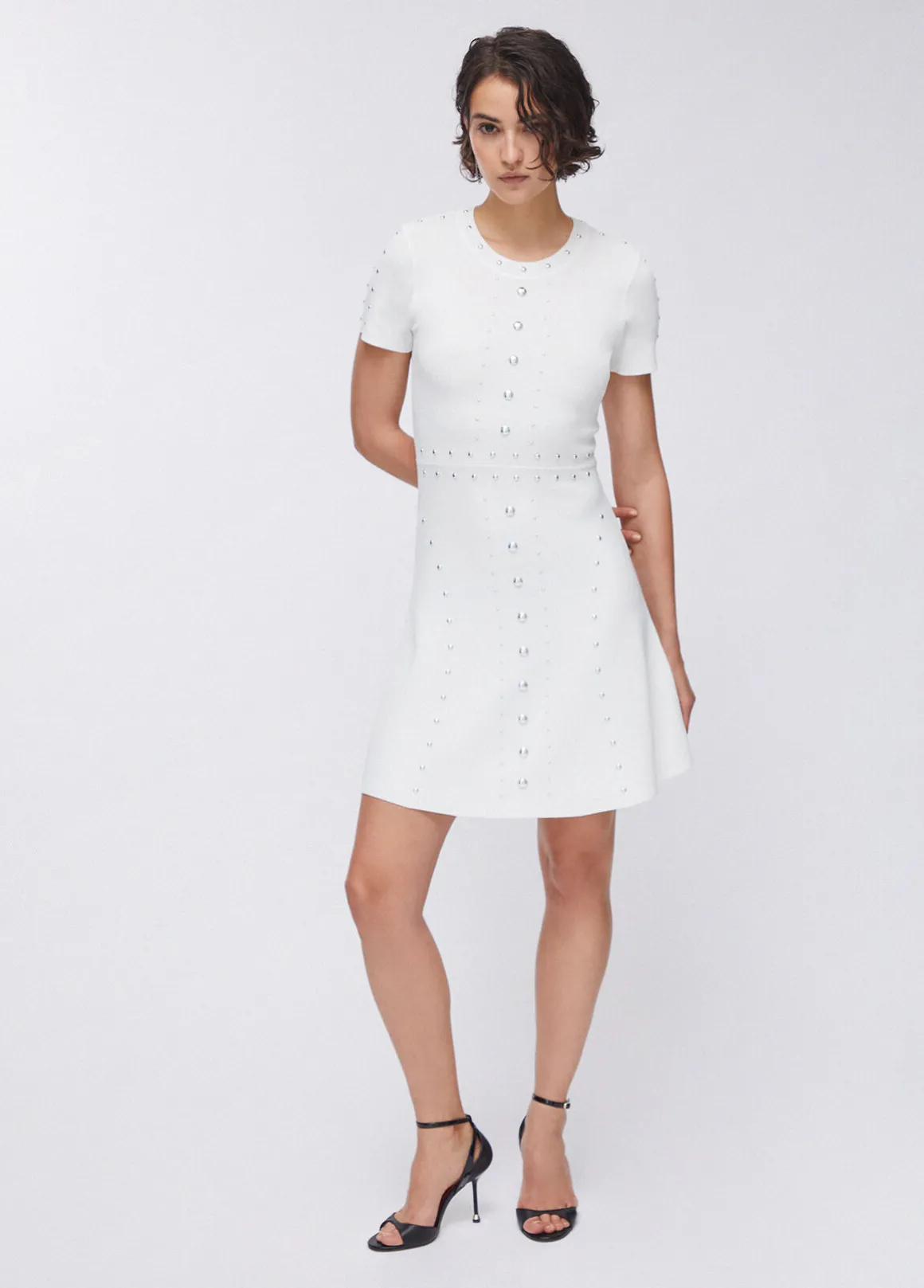 Abito in maglia con borchie
