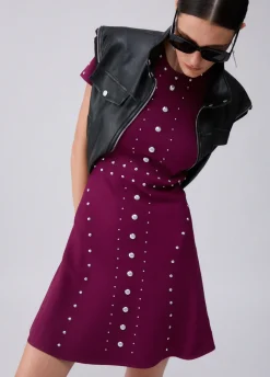 Abito in maglia con borchie