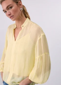 Blusa con catena gioiello