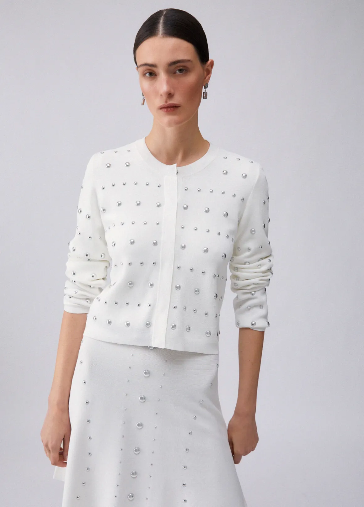 Cardigan con borchie