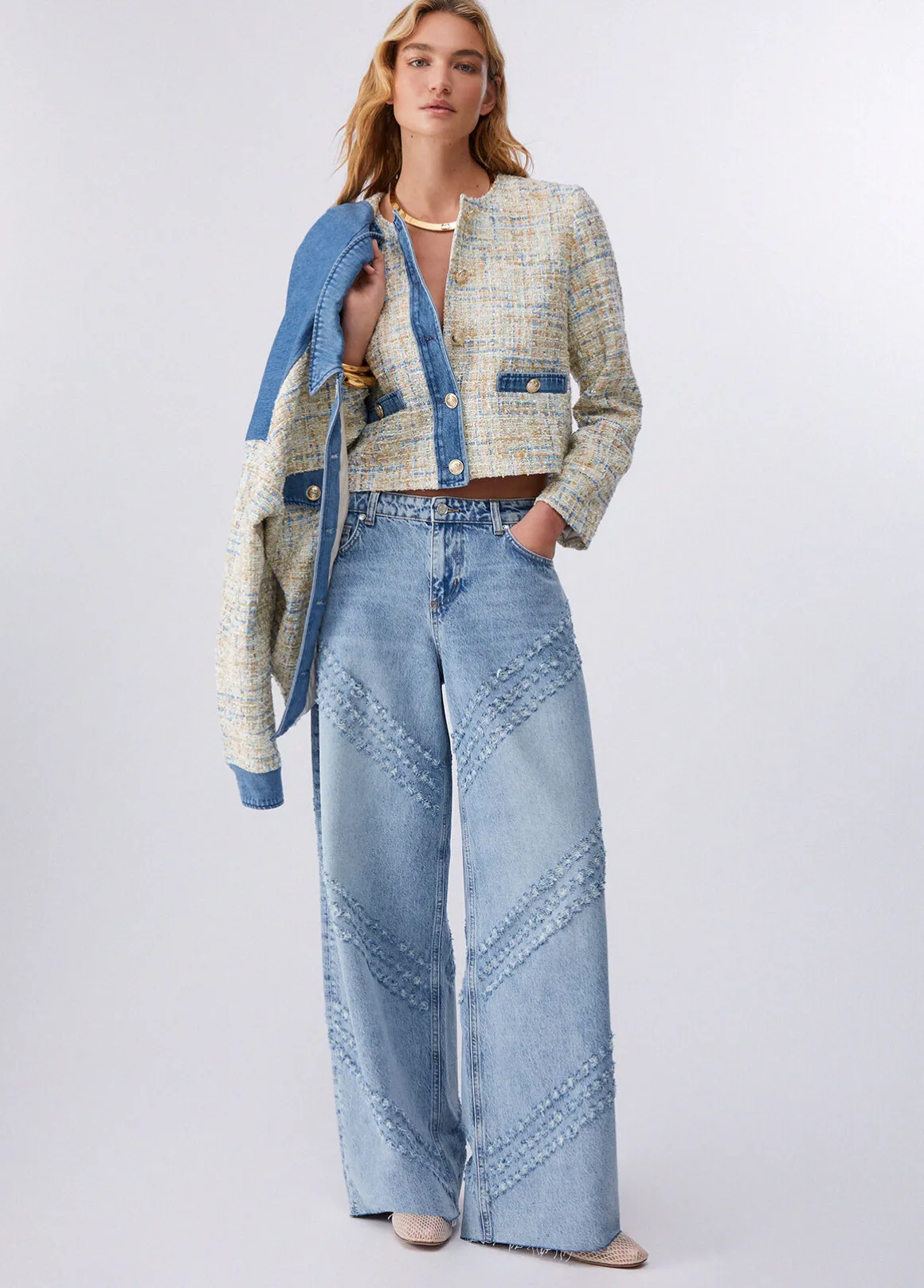 Giacca bouclé con dettagli in denim