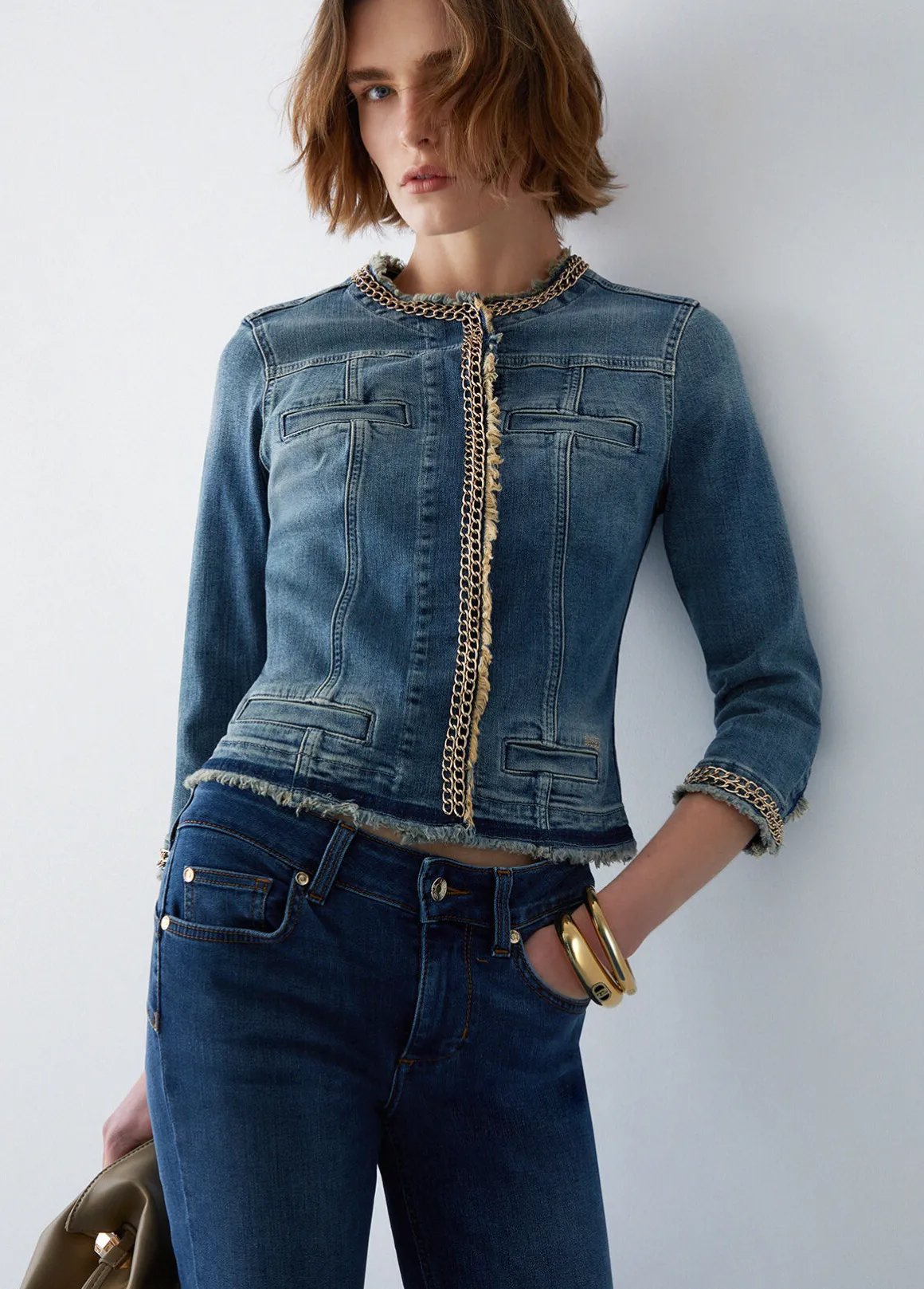 Giacca in denim con catene gioiello