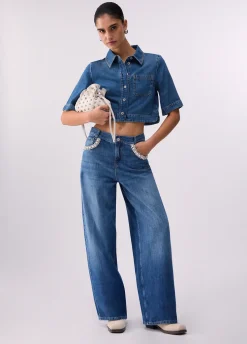 Jeans flare con applicazioni gioiello