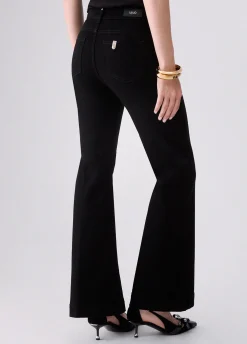 Jeans flare con bottoni gioiello