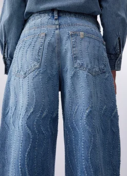Jeans flare con dettagli laserati