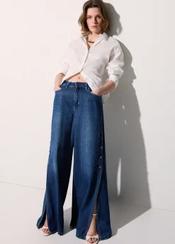 Jeans flare con spacchetti