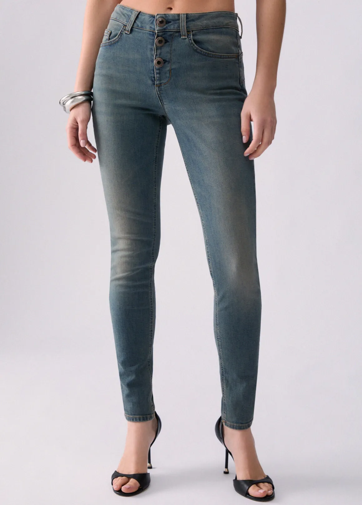 Jeans skinny con bottoni lavorati