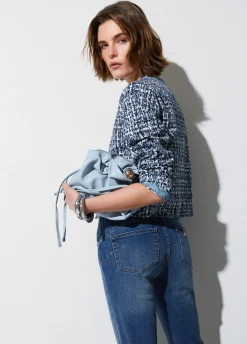 Jeans skinny con risvolto
