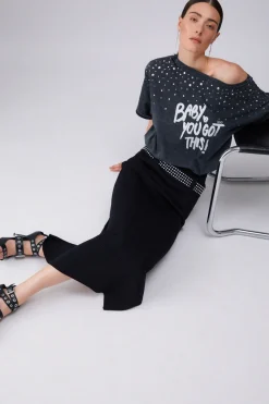 Longuette in maglia con borchie
