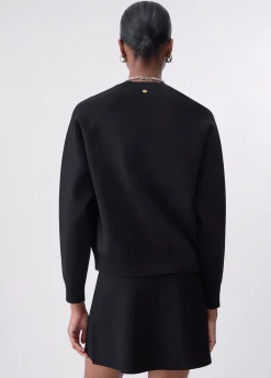 Maglia boxy con dettagli intrecciati
