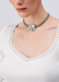 Maglia scollo a V con borchie
