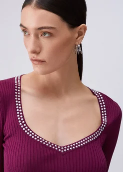 Maglia scollo a V con borchie
