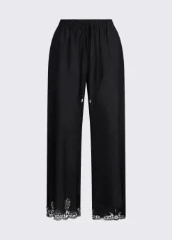 Pantaloni con ricami traforati