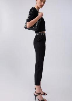 Pantaloni eleganti con borchie