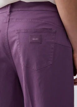 Pantaloni flare a vita alta