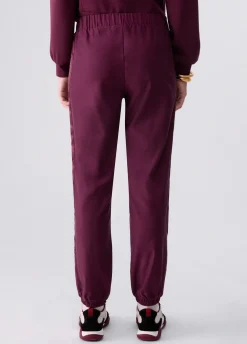 Pantaloni jogging con tape logato