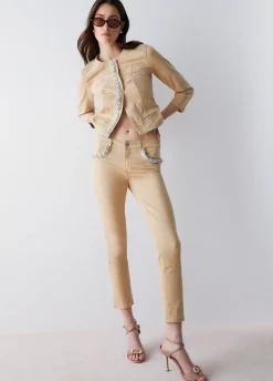 Pantaloni skinny con applicazioni gioiello