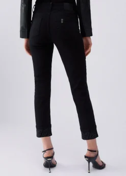 Pantaloni skinny con risvolto e strass