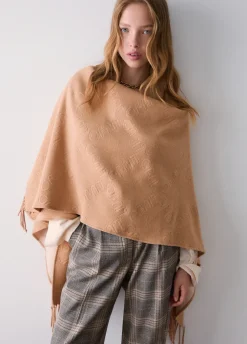 Poncho con logo embossed