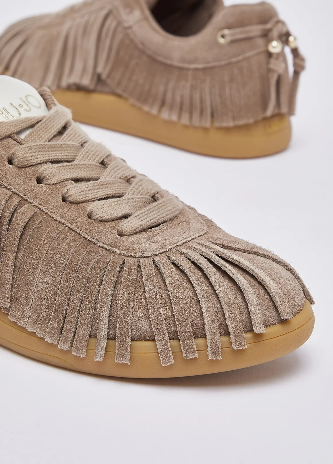 Sneakers in suede con frange