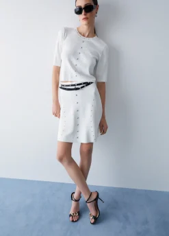 Top in maglia con borchie