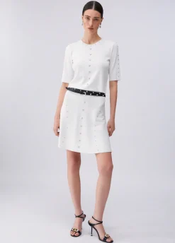 Top in maglia con borchie