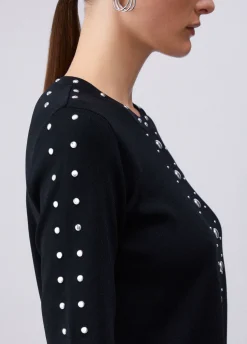 Top in maglia con borchie