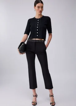 Top in maglia con borchie