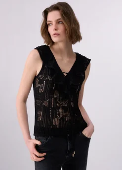 Top in pizzo con volant