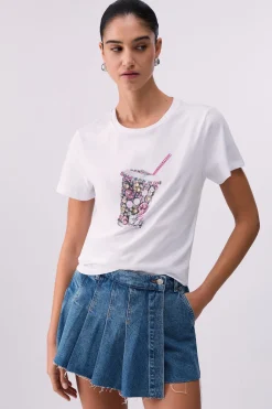 T-shirt con stampa e applicazioni